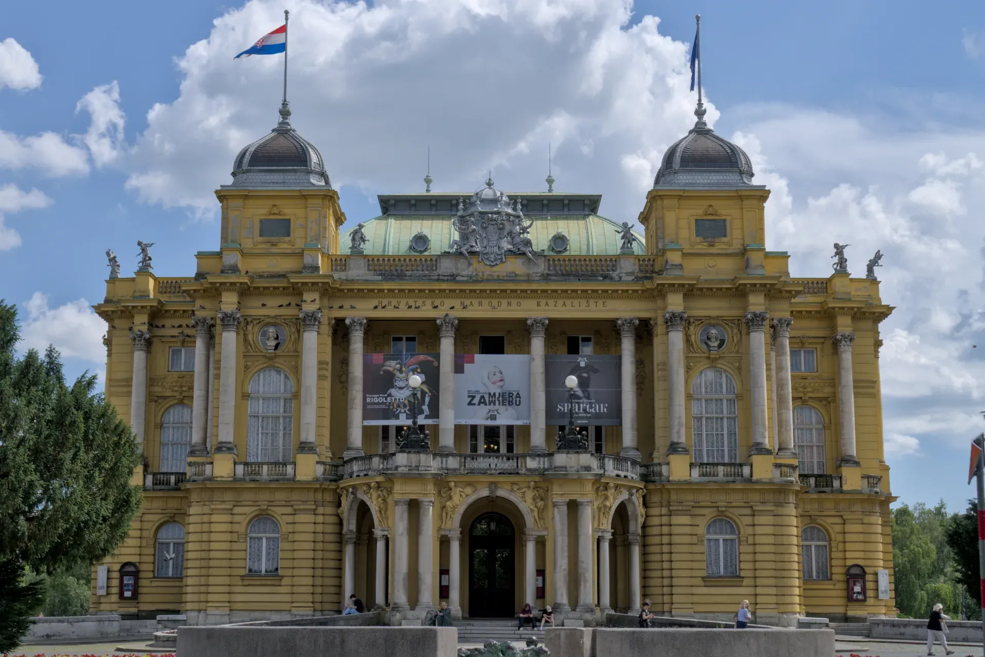 The Croatian National Theatre in Zagreb with its striking yellow facade and Neo-Baroque architecture.