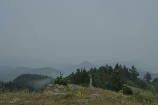Viewpoint on Janić summit, looking towards the Serbian side with misty mountains.