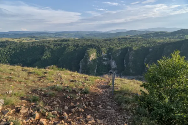 View from the "Prayer" viewpoint over the Uvac Canyon in Serbia, with forests and slopes.