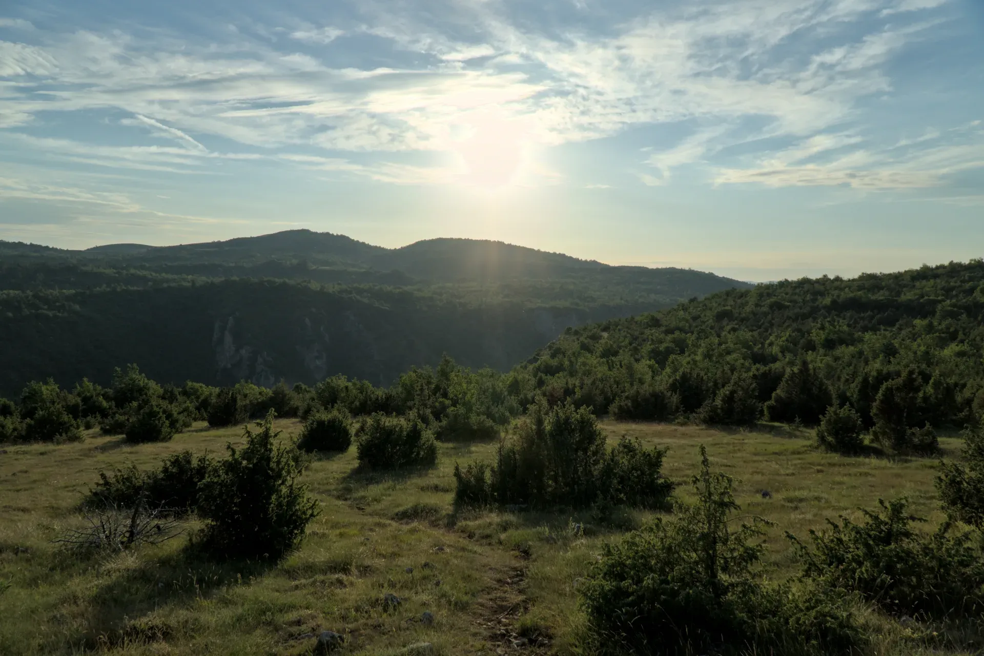 Sunset at Molitva viewpoint over forested hills in Serbia, ideal for wall art.