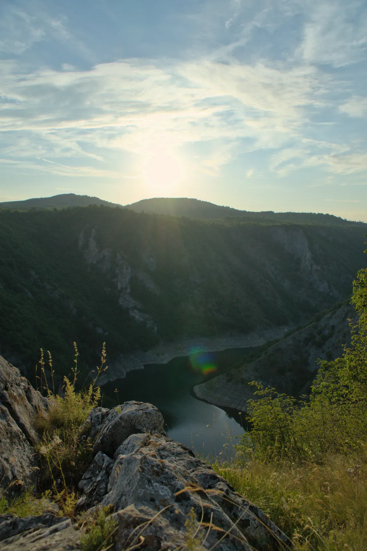 A stunning portrait of the Uvac Gorge in Serbia at sunset, featuring a bend in the river in the valley.