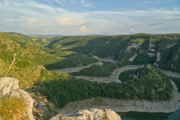 Meanders of the Uvac river in Serbia, captured in the warm light of the setting sun.
