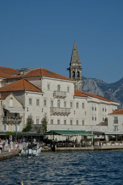 Buildings of Perast, Montenegro, in the evening light overlooking the sea.