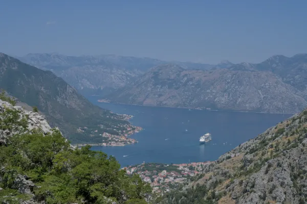 View from above of the Bay of Kotor in Montenegro with a cruise ship entering.