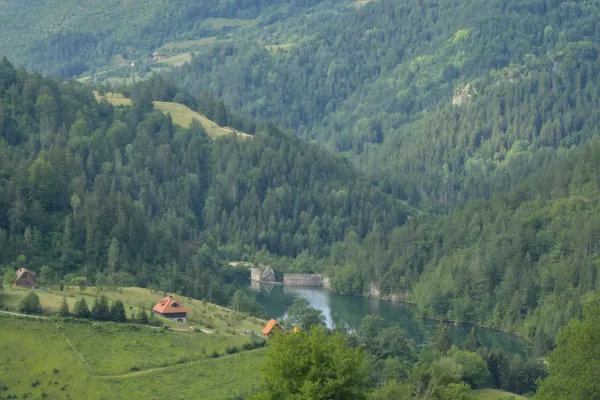 View of mountainous meadows, Spajići Lake, and the dam in Zaovine, Serbia.