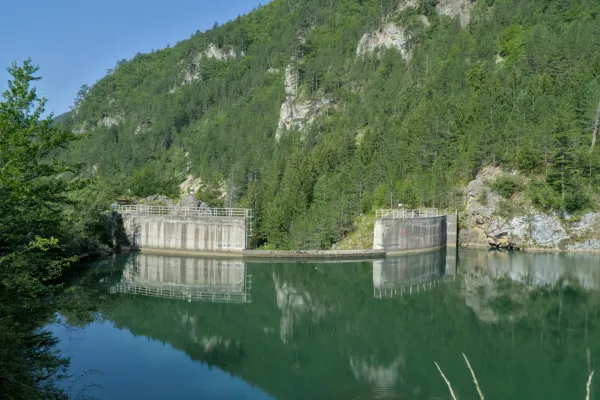 Spajići Dam at Zaovine, surrounded by green mountains with reflections in the water.