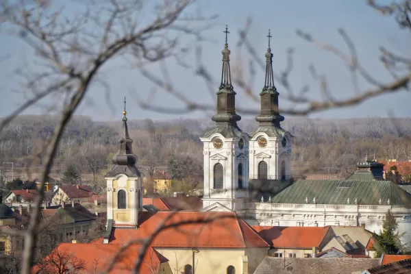The Church of Saint Nicholas in Sremski Karlovci, Serbia, with its distinctive spires and red roofs.