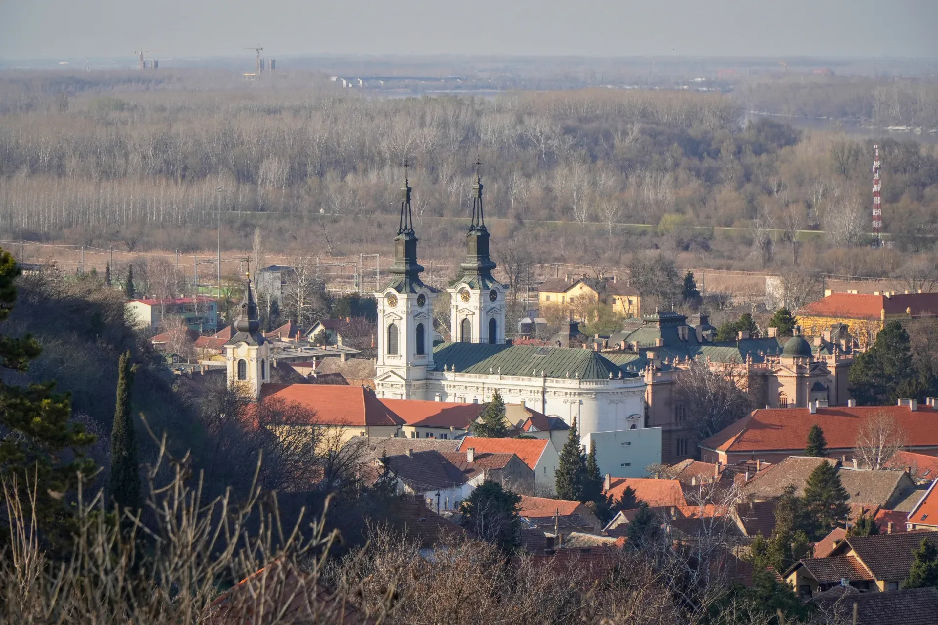 Aerial view of St. Nicholas Church in Novi Sad, Serbia, showcasing its detailed architecture and surrounding cityscape.