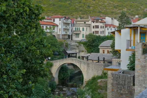 A scenic view of the Crooked Bridge in Mostar, Bosnia and Herzegovina, captured in a fine art style.