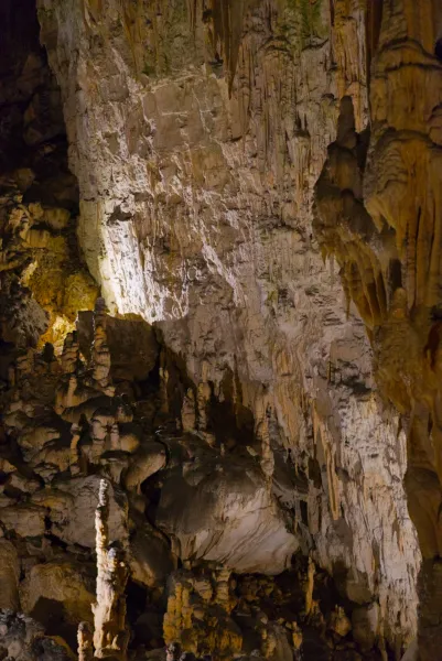The underground world of Postojna Cave with stalactites and stalagmites.