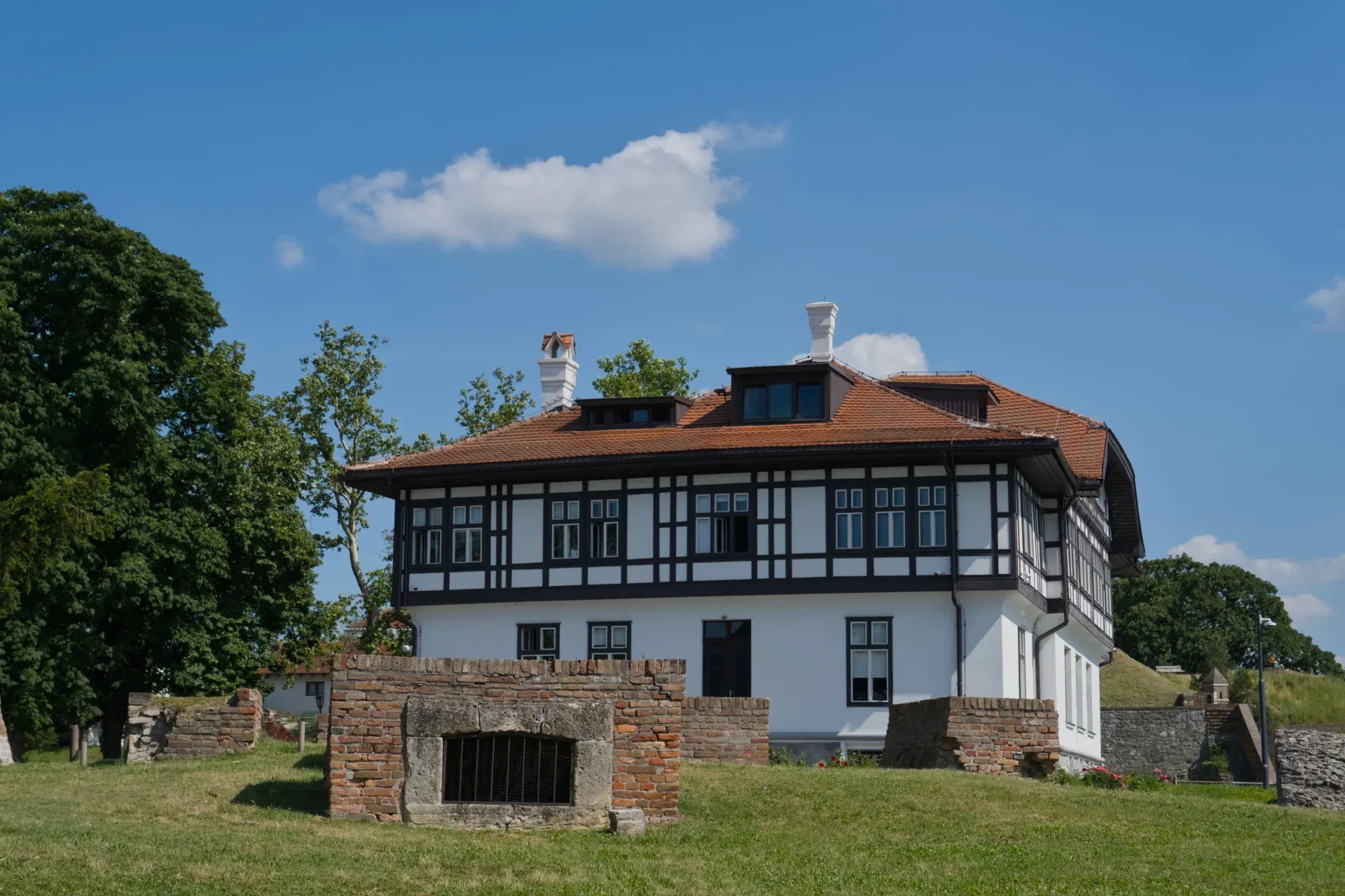 Historic house Kalemegdan in Belgrade, Serbia, with traditional architecture and tiled roof under a clear blue sky.