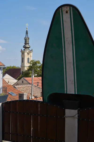Zemun, Belgrade: Portrait photograph of a historic church tower against a blue sky.