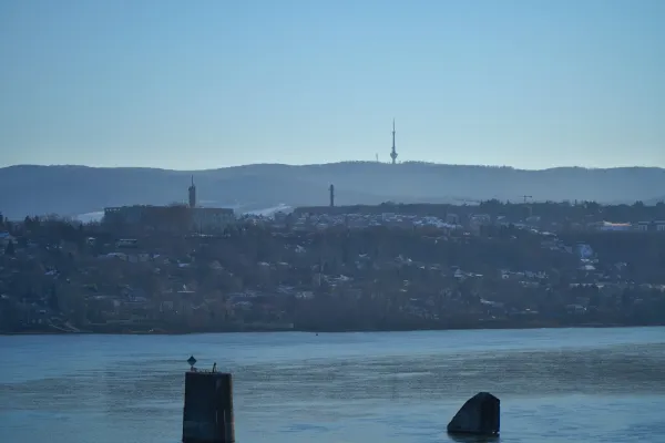 View of Fruška Gora and the TV Tower from Petrovaradin Bridge, Serbia, with the river in the foreground.