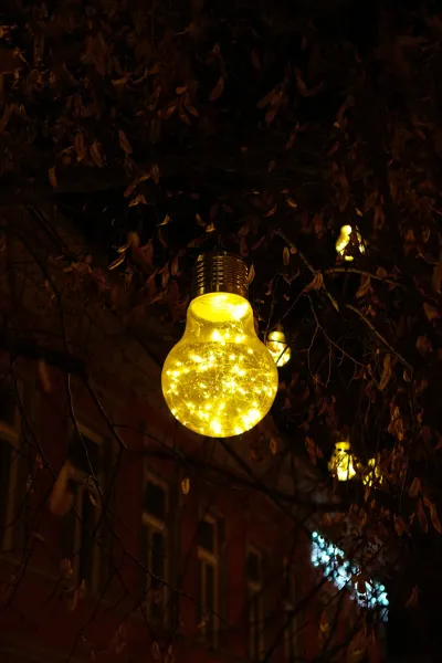 New Year's illumination in the form of a light bulb with warm lights on Jovana Jovanovića Zmaja Street in Novi Sad.