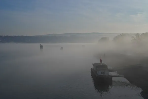Pier in fog on the Danube with a view of Fruska, suitable for gallery or print.