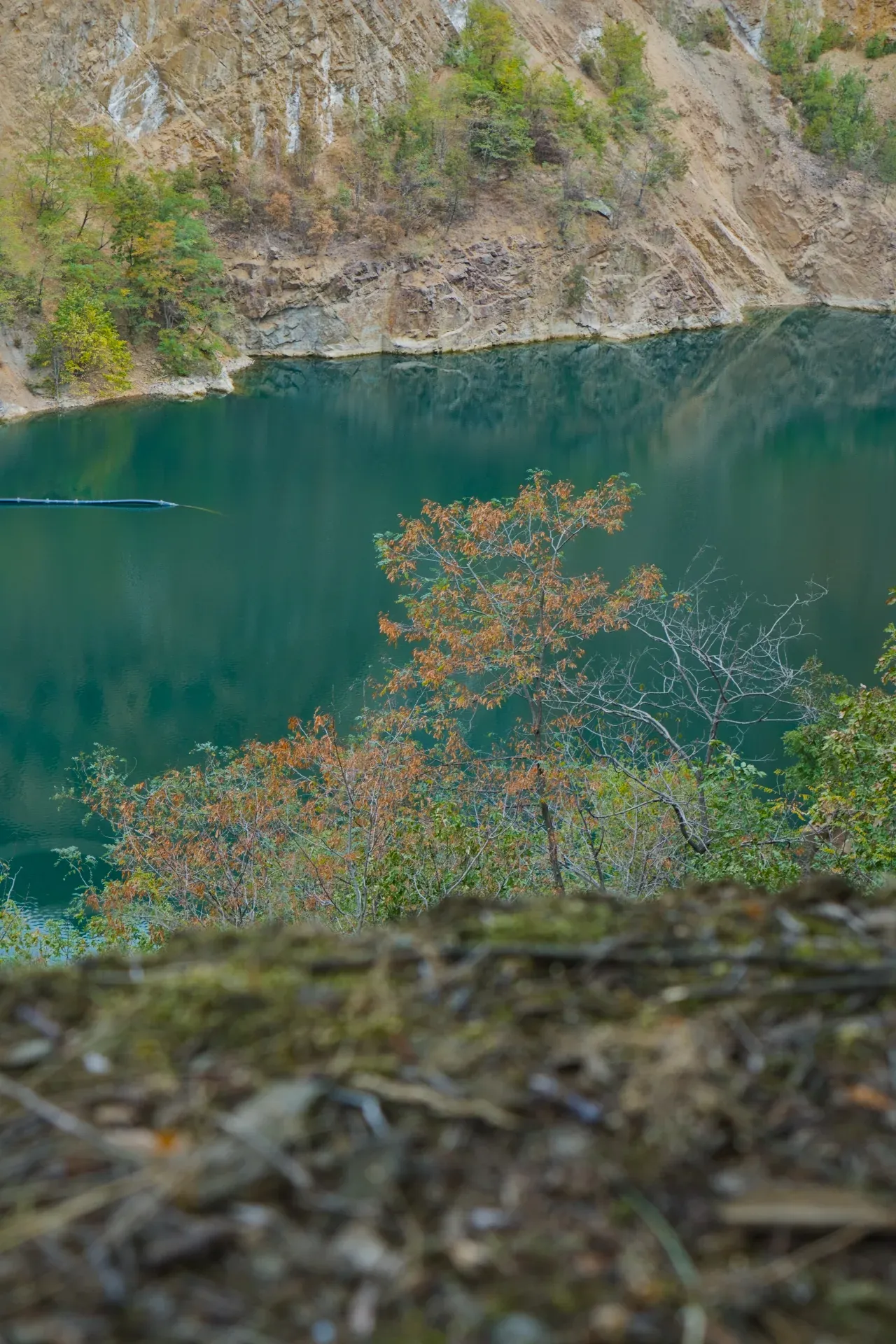 View of the northern rocky shore of Ledinačko Lake from the viewpoint on the southern bank, Serbia.